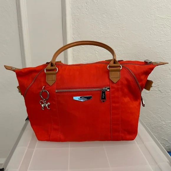 Kipling bright orange bag with brown leather straps - Picture 1 of 12